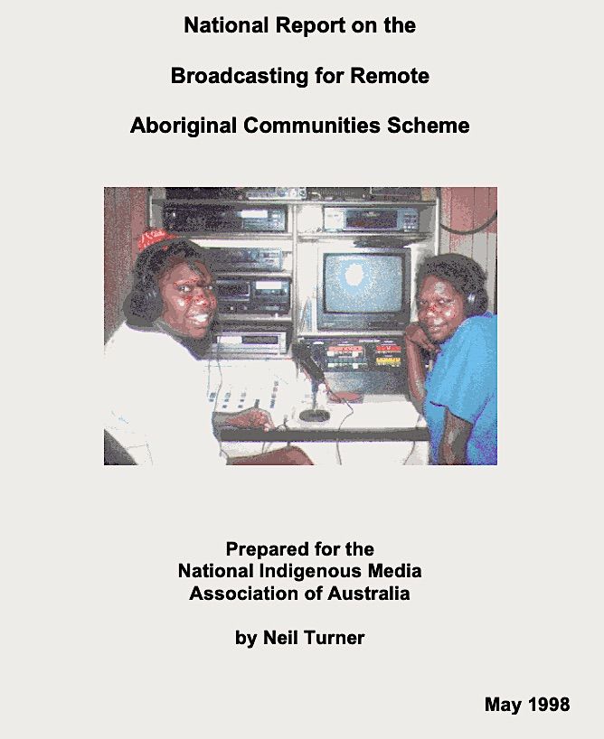 Scanned image of two women sitting and smiling in front of a video equipment, with the caption Brodacasting for Remote Aboriginal Commuinties Scheme..